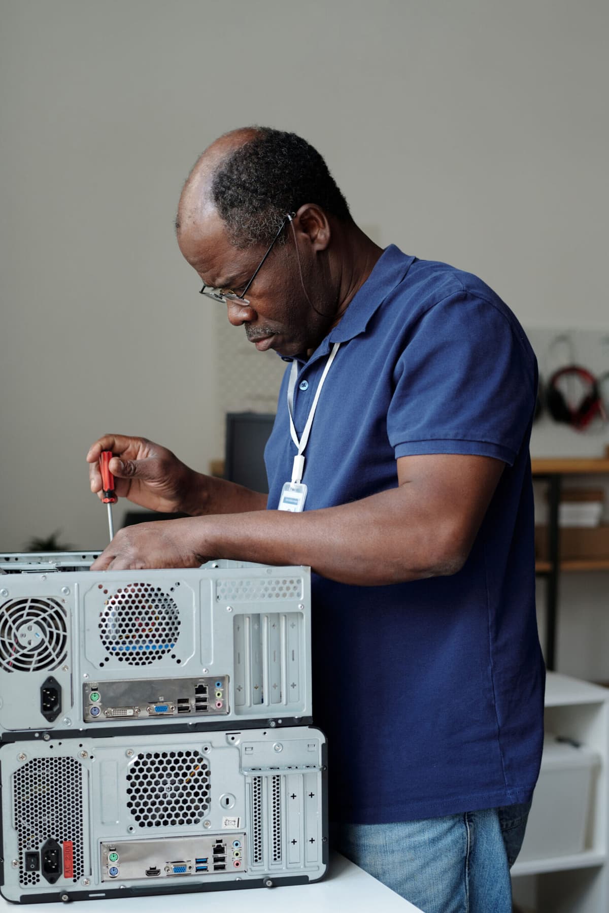 Volunteer refurbishing a donated device